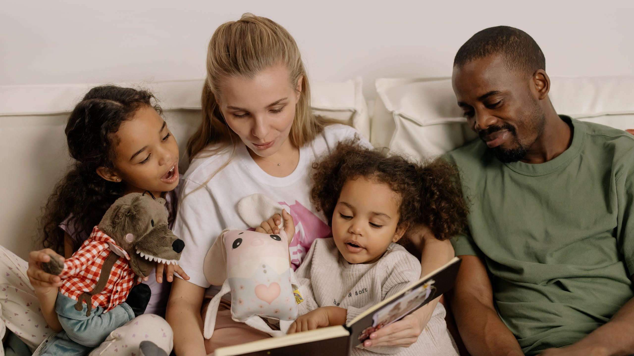 Photograph of a Family Looking at a Photo Album